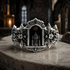 Gothic altar ring in oxidized sterling silver, cathedral arch portal set with a crimson moissanite, front view