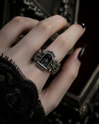 Model wearing the Crimson Portal Gothic altar ring, oxidized sterling silver statement ring on the hand