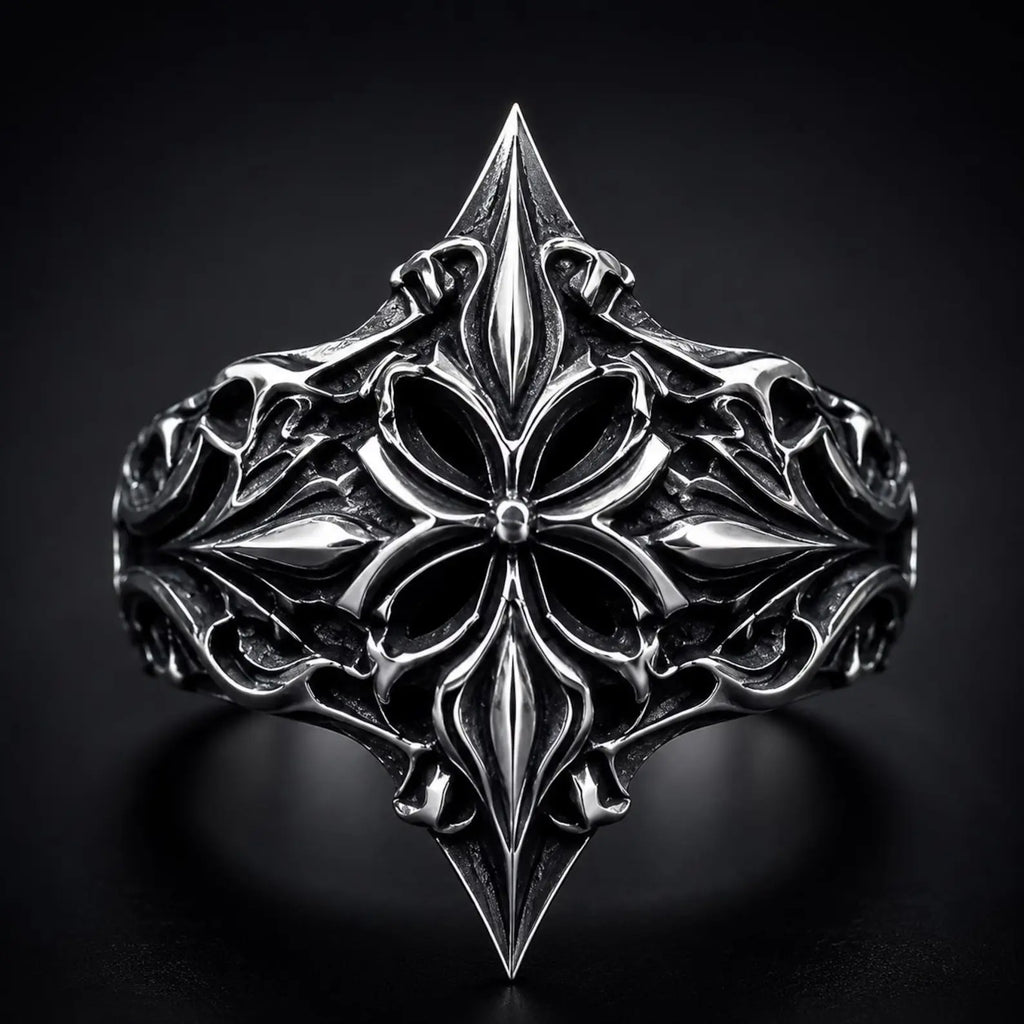 Lozenge shield ring close-up — heraldic fleur-de-lis cross motif in deep-relief oxidized sterling silver