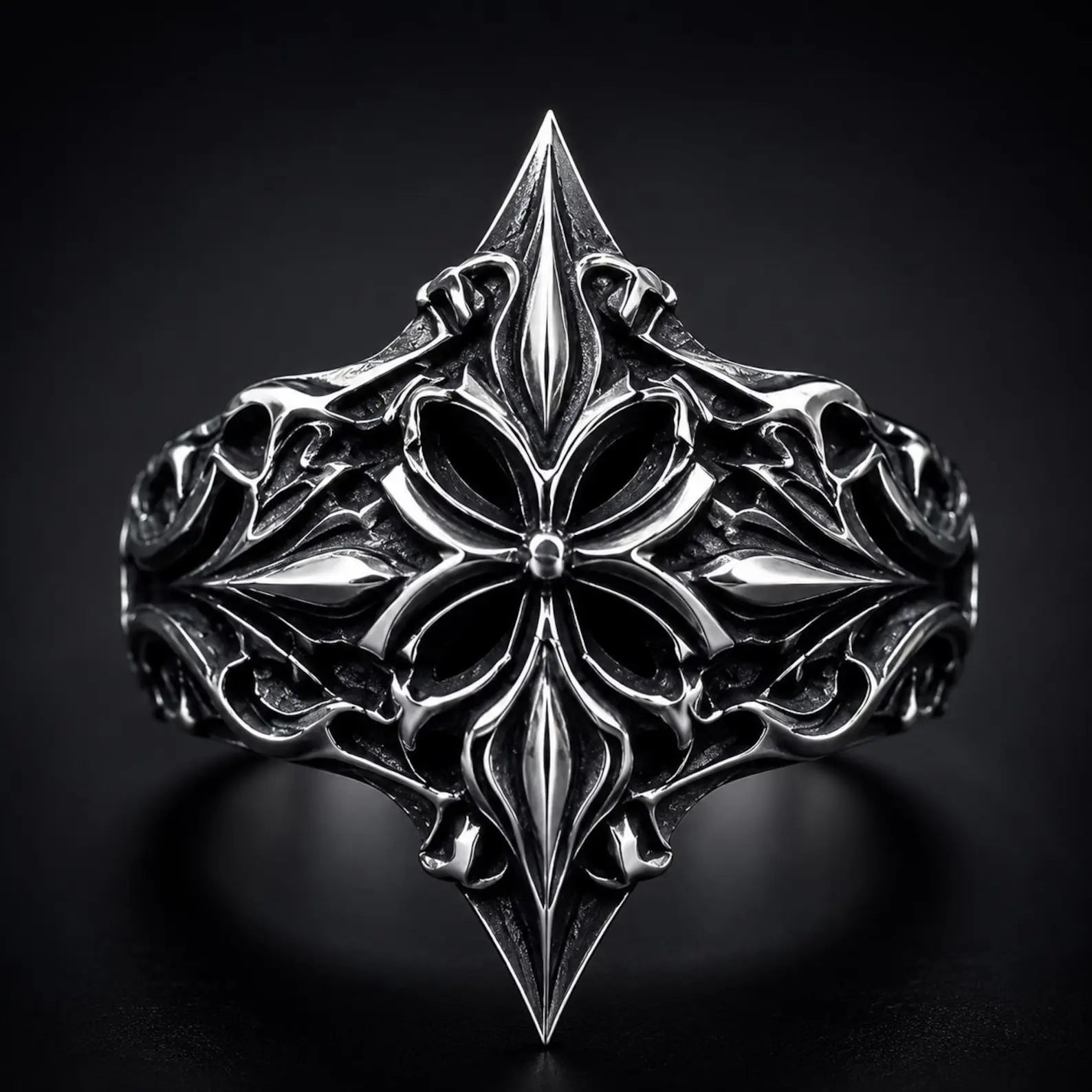 Lozenge shield ring close-up — heraldic fleur-de-lis cross motif in deep-relief oxidized sterling silver