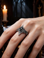 Hand wearing gothic cathedral chevron ring with black onyx — alternative wedding band in 925 silver
