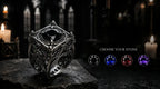 Reliquary Cage Ring flat lay top view — lozenge cage architecture with corner spires, oxidized sterling silver