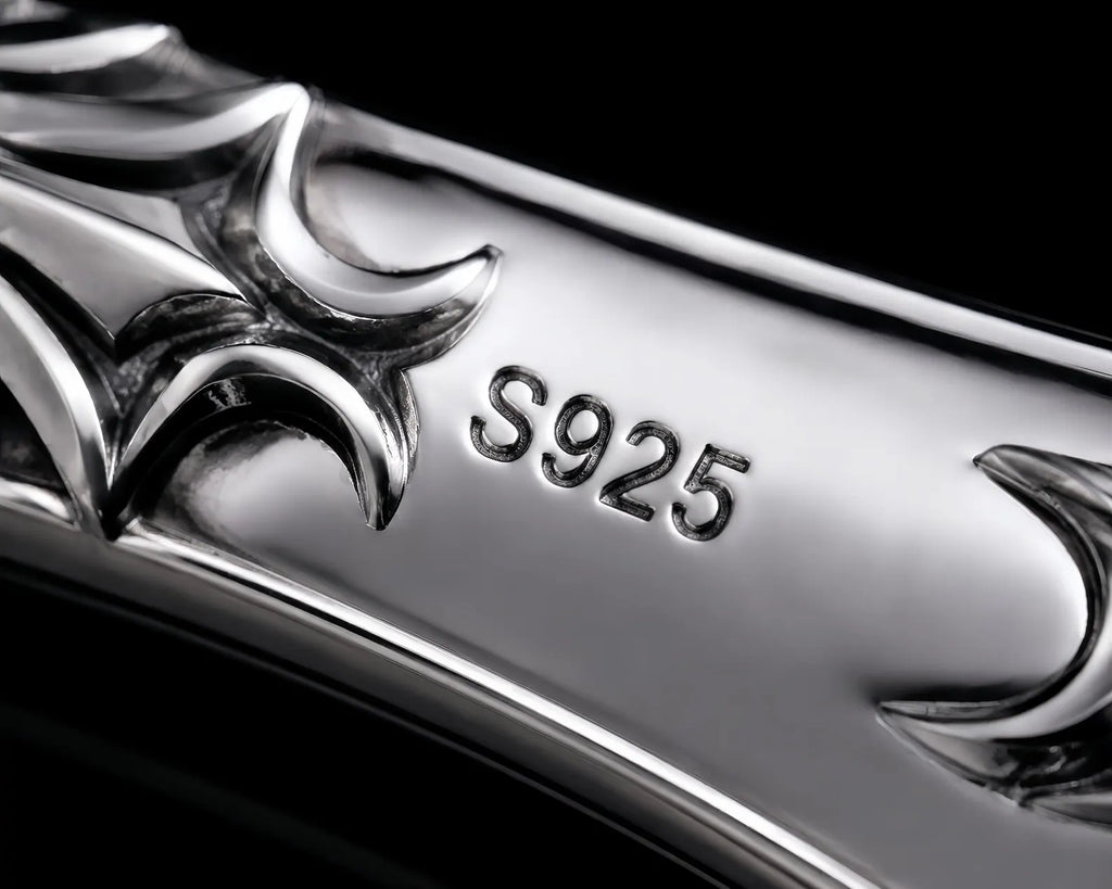Macro close-up of the sterling silver handle showing the S925 hallmark and cyber-sigilism cutouts