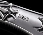 Macro close-up of the sterling silver handle showing the S925 hallmark and cyber-sigilism cutouts