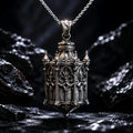 Sterling silver Cathedral Lantern Gothic pendant necklace on a chain against dark rock
