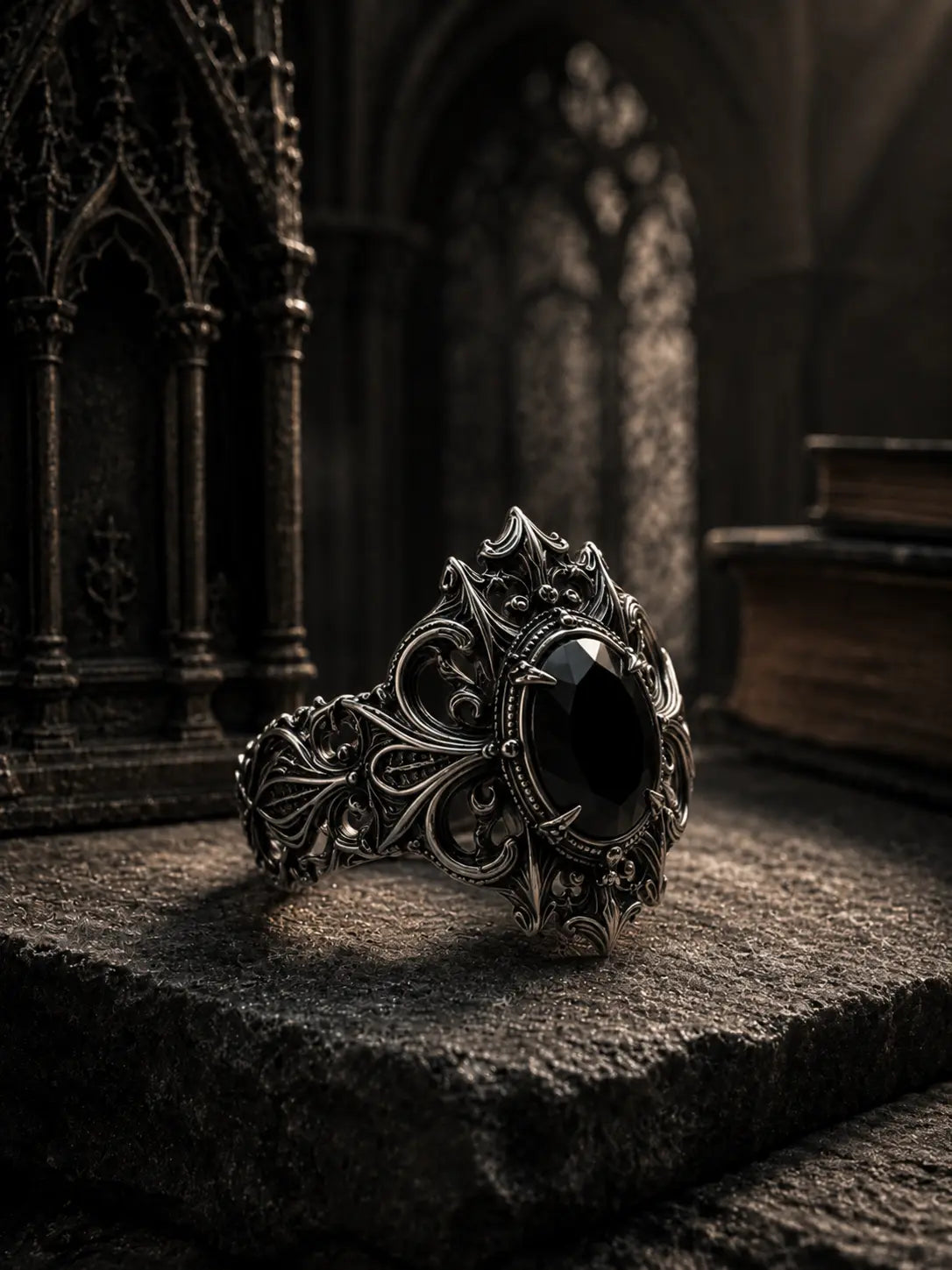 Cathedral crest ring with black onyx gemstone — hand-oxidized scrollwork and gothic architectural band